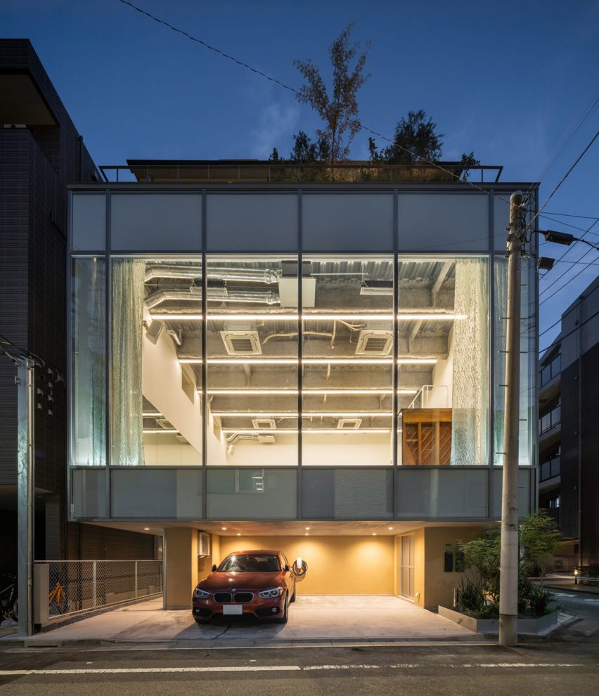 Front elevation of Tokyo Ballet House showing a projecting glazed dance studio at street level