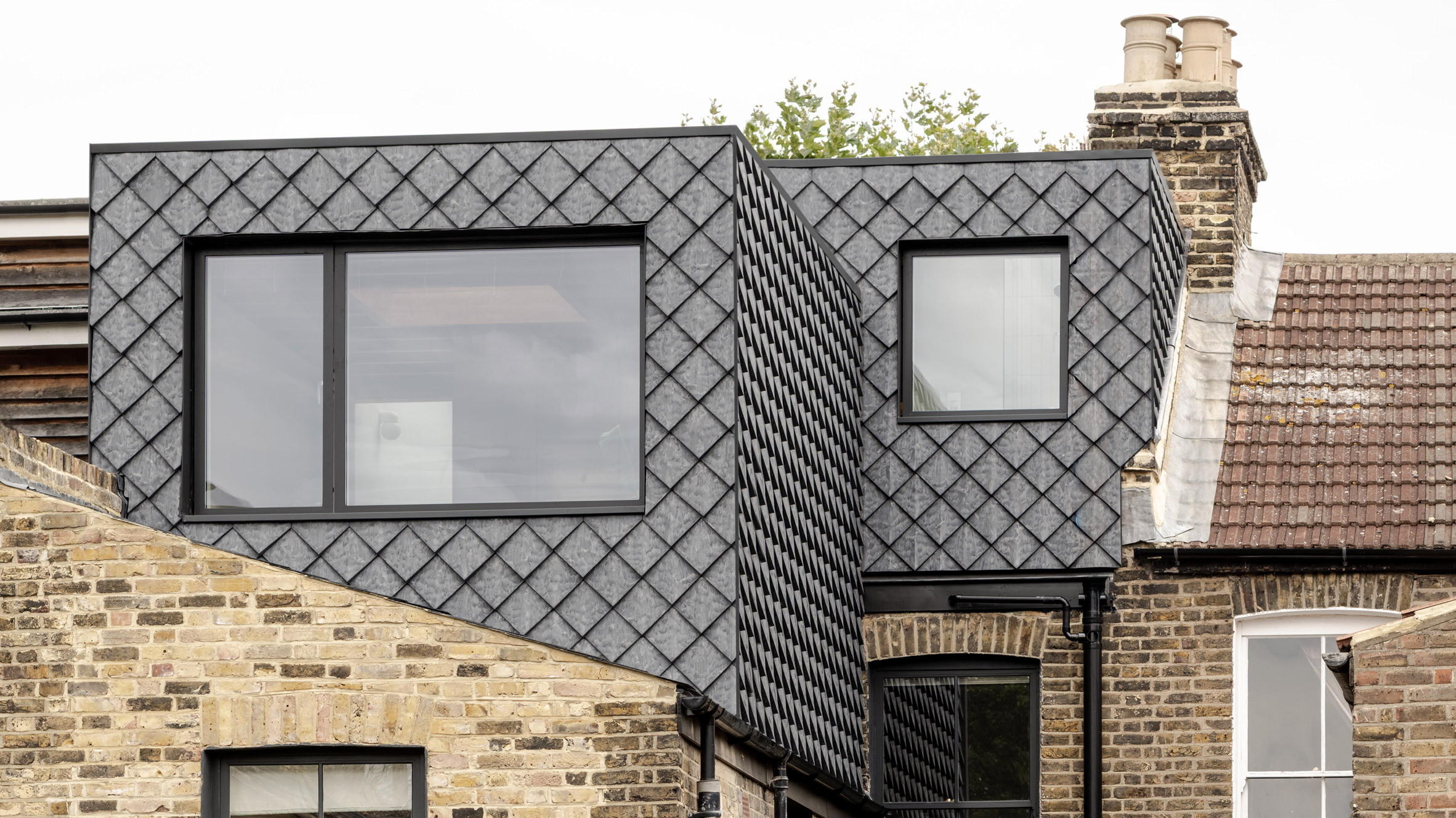 https://static.dezeen.com/uploads/2026/07/yn-studio-tile-house-extension-london-hero_dezeen_2364_col_2.jpg
