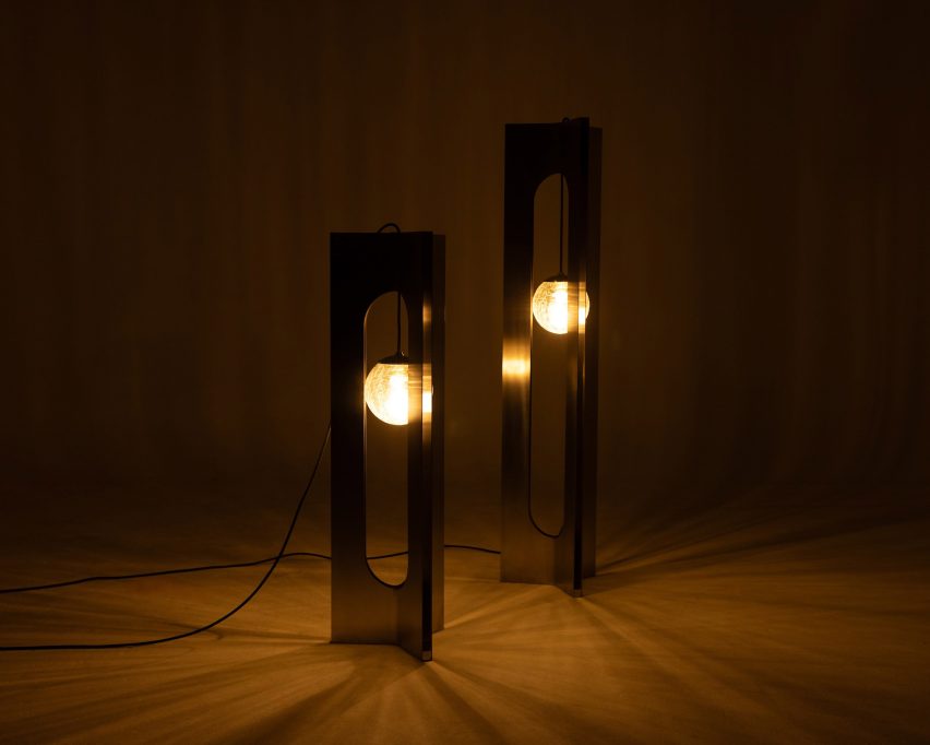 Two illuminated lamps in a dark space