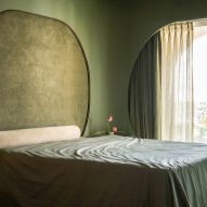 Mumbai apartment designed to feel like "arriving at the edge of a still body of water"