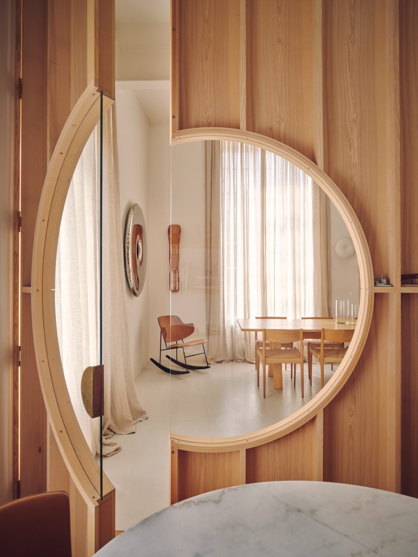 View through circular window in Apartment 21 by Piercy & Company