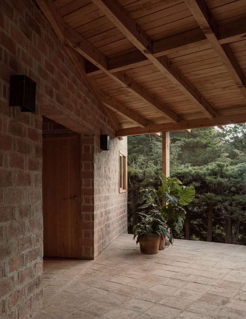 External corridor at earthen home by Colar