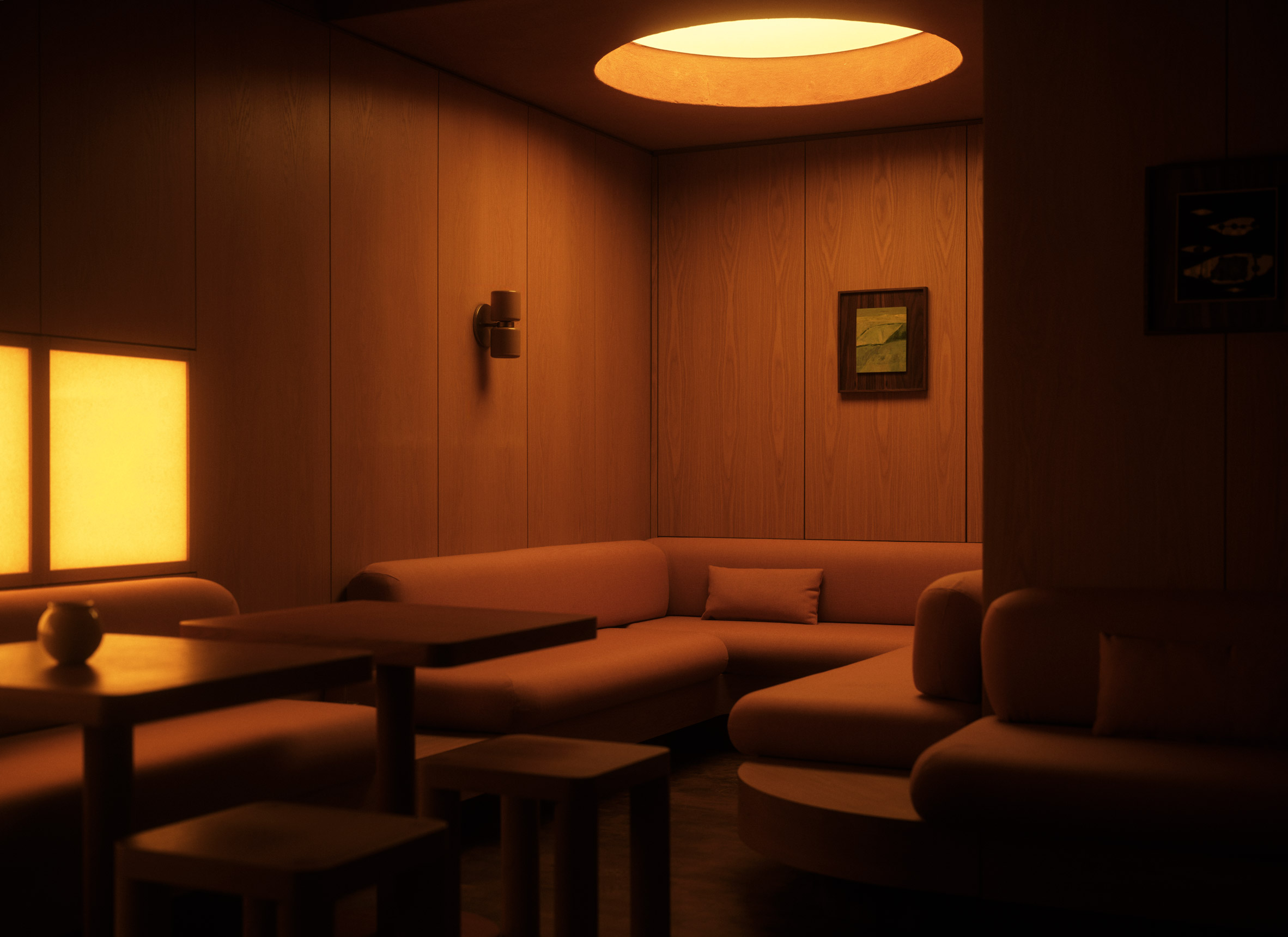 Oculus above sofas in dark room