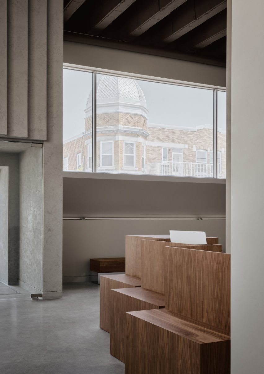 A staggered walnut reception counter within a veterinary clinic
