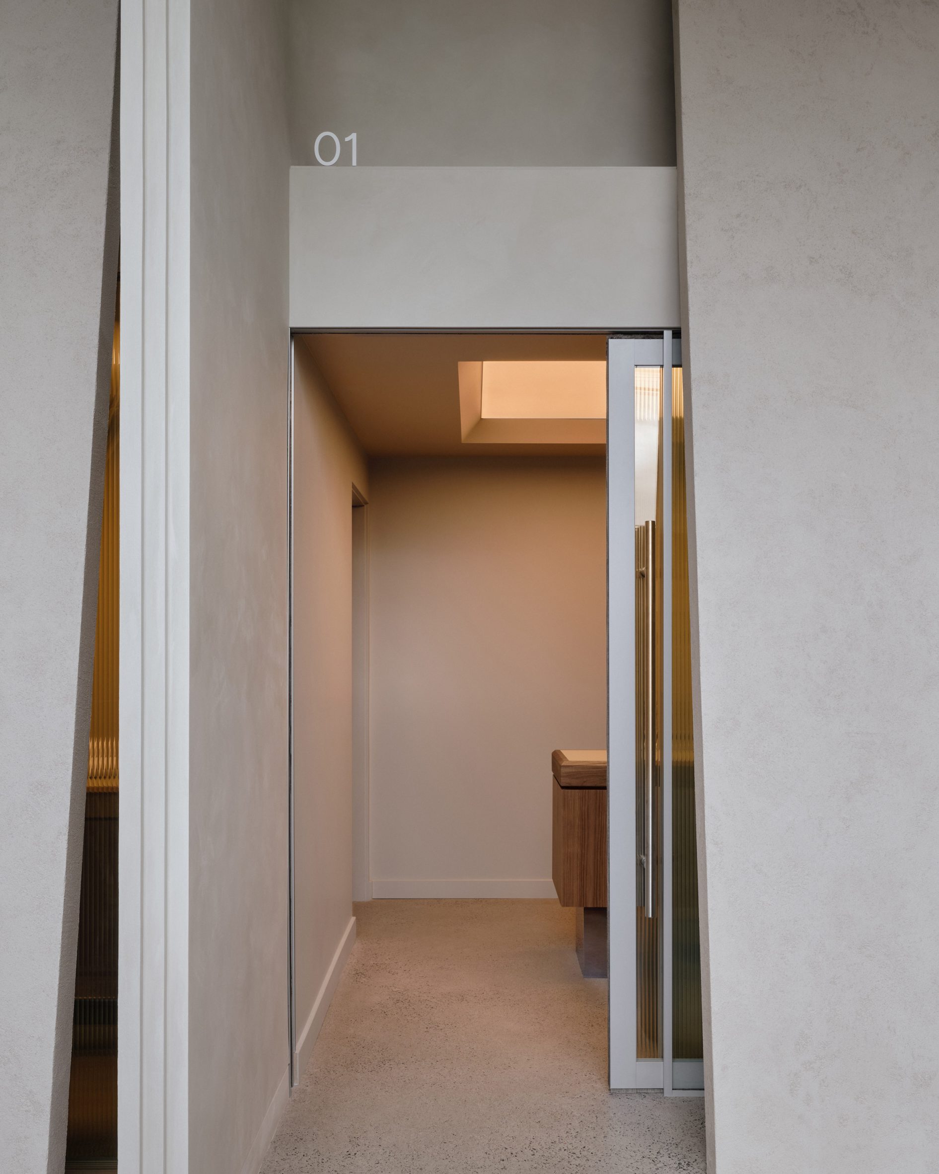 Fluted glass doors slide open to vet consultation rooms