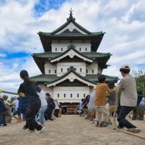 Volunteers tug 360-tonne castle tower towards its original site
