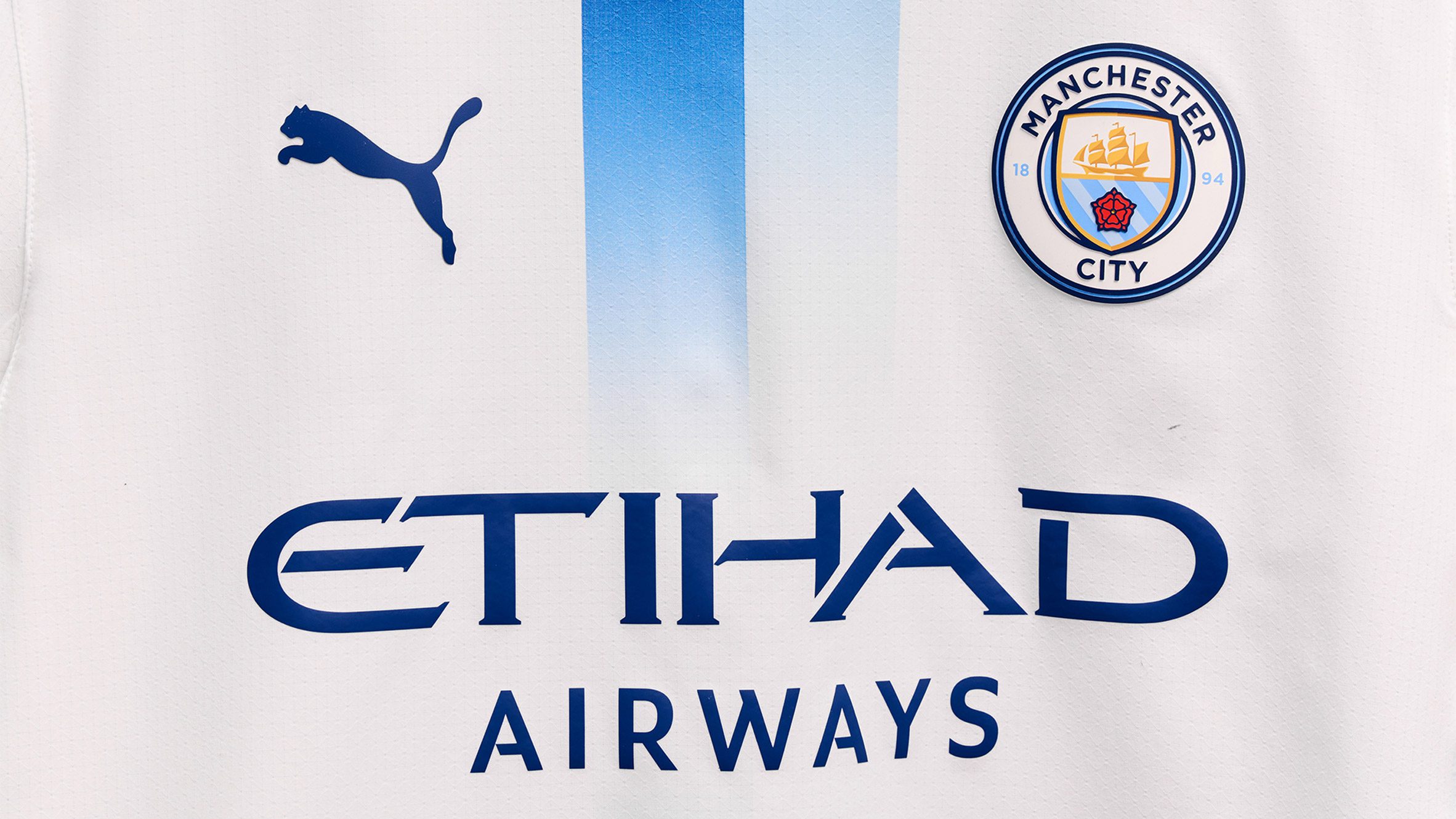 White kit with blue stripe
