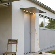 Modular home with sloping facade by Papundekl Architects