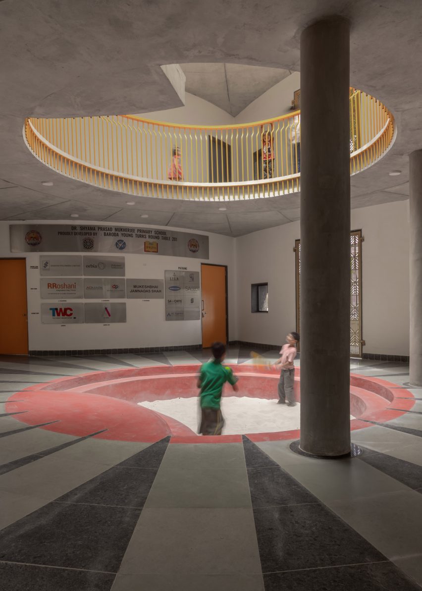 triple-height atrium with a sandpit