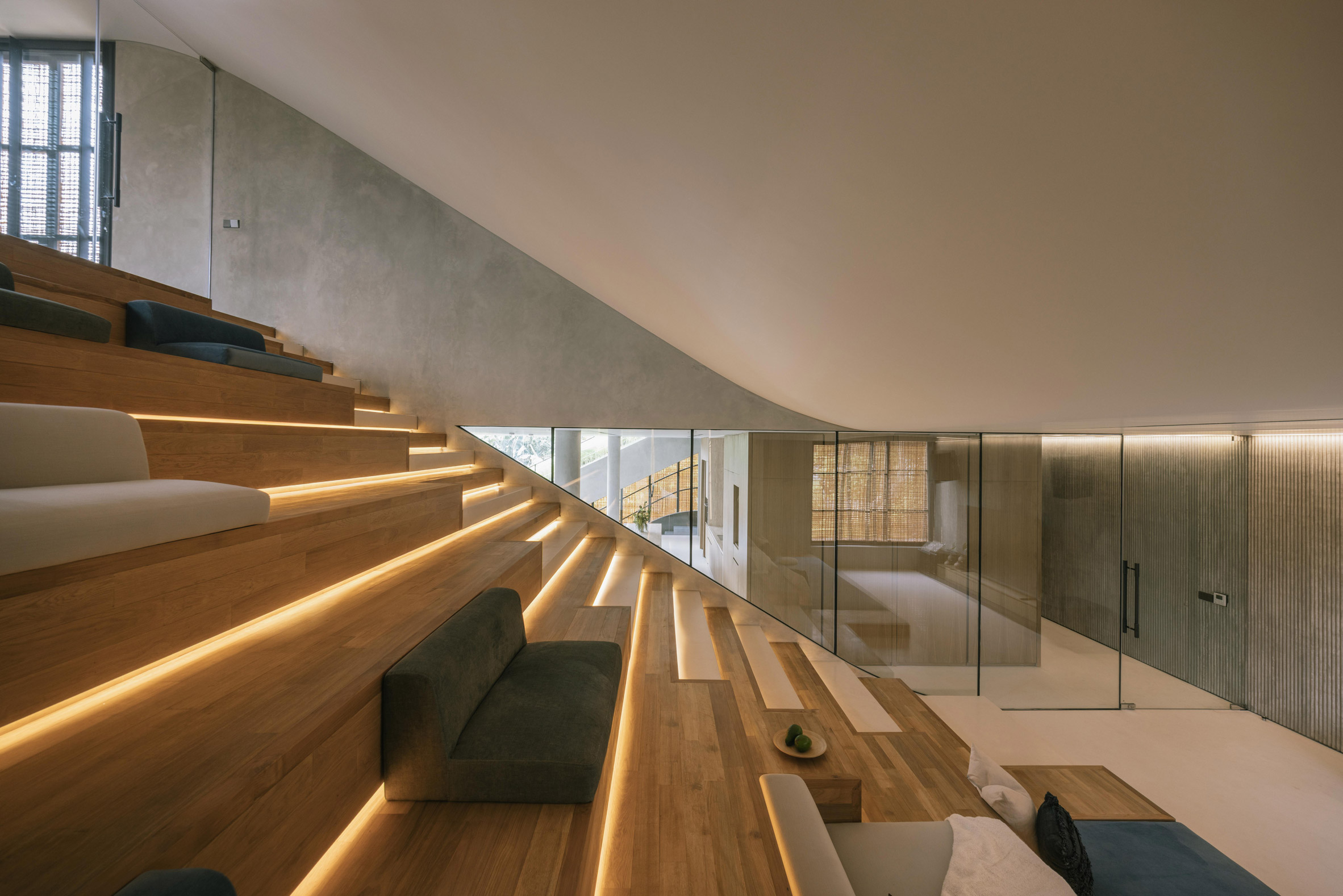 Stepped TV room at Split Mass Residence in Indonesia by K-Thengono Design Studio