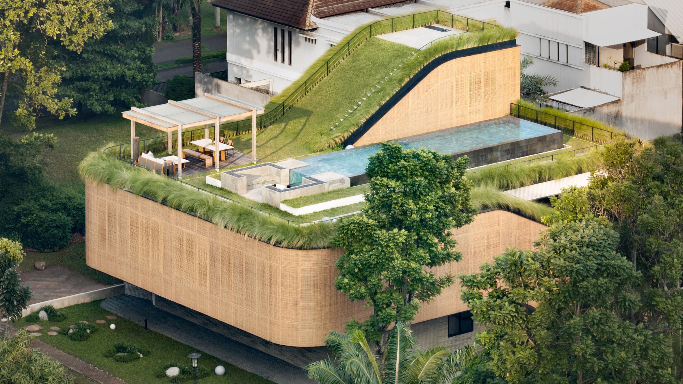 https://static.dezeen.com/uploads/2026/08/split-mass-residence-k-thengono-design-studio-indonesia_dezeen_2364_hero_1.jpg