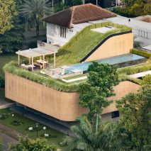 Sloping green roofs "keep family connected" at Indonesian home
