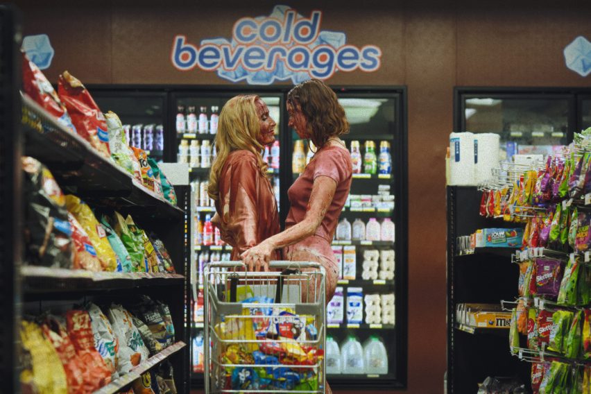 Two blood-covered women in a gas station aisle