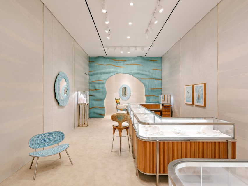 A store interior with blue hues applied to chairs and mirror frames