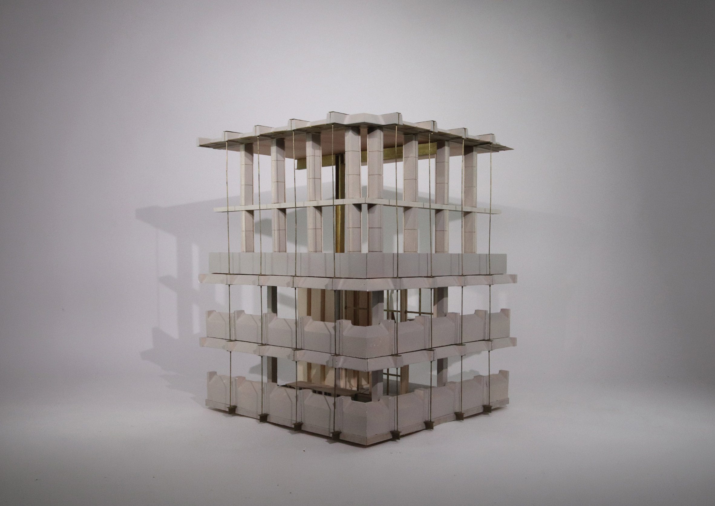 Photograph of an architectural model on a white backdrop