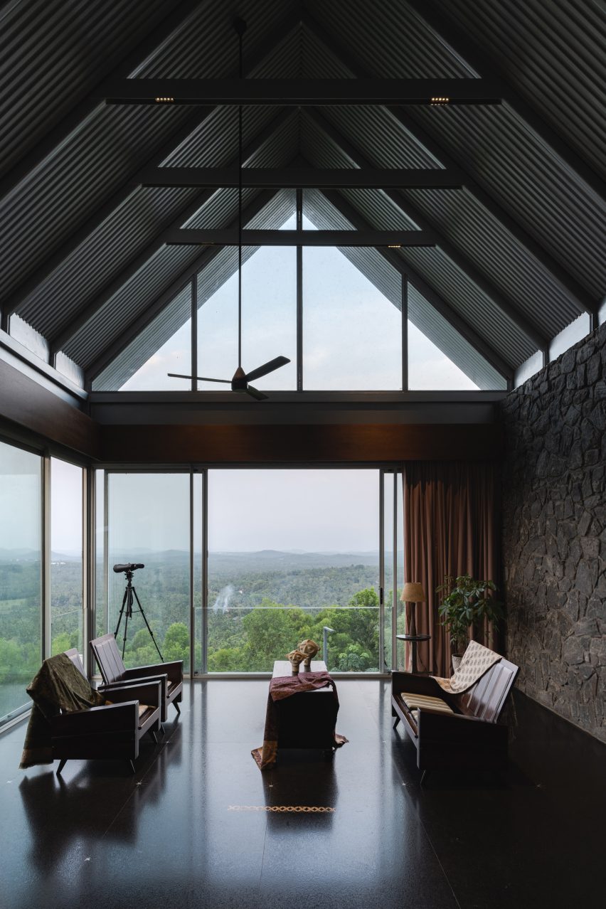 Ushas farmhouse interior beneath a pitched roof with mountain views