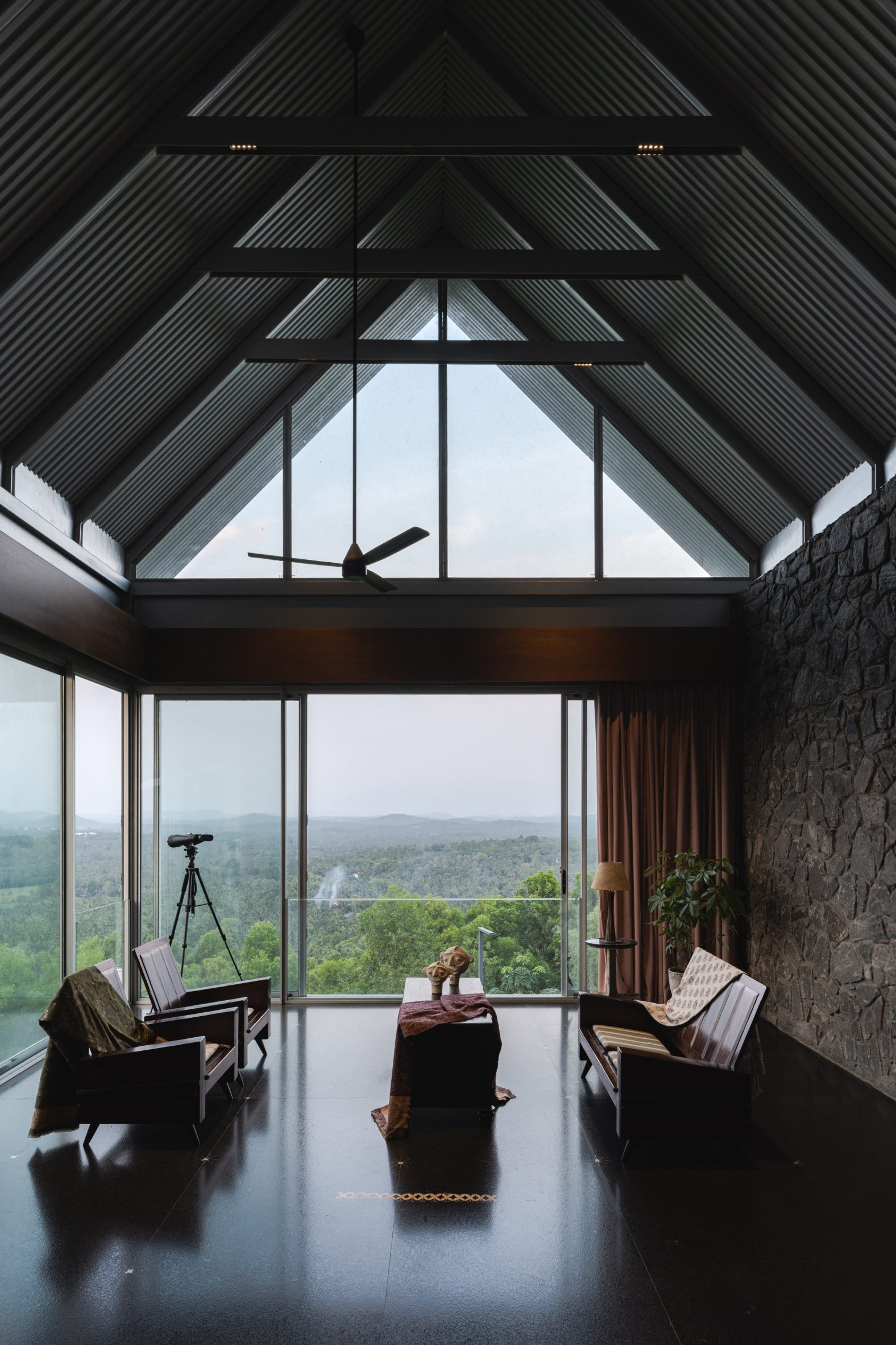 Ushas farmhouse interior beneath a pitched roof with mountain views