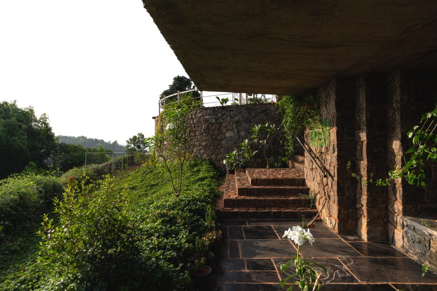 Granite steps leading to an open-air temple beneath Ushas farmhouse