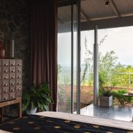 Bedroom interior of Ushas farmhouse overlooking mountain views