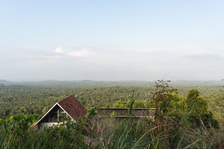 Ushas farmhouse overlooking a forested landscape in Kerala