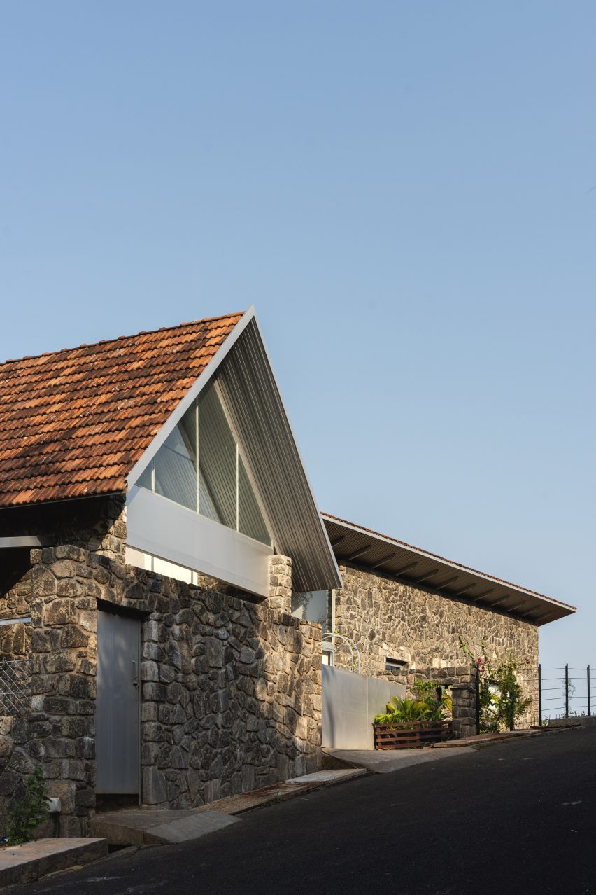 Street view of Ushas farmhouse with granite walls and pitched tiled roof