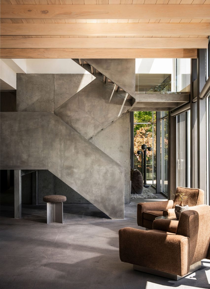 A steel staircase refaced in a metallic plaster to add depth and texture