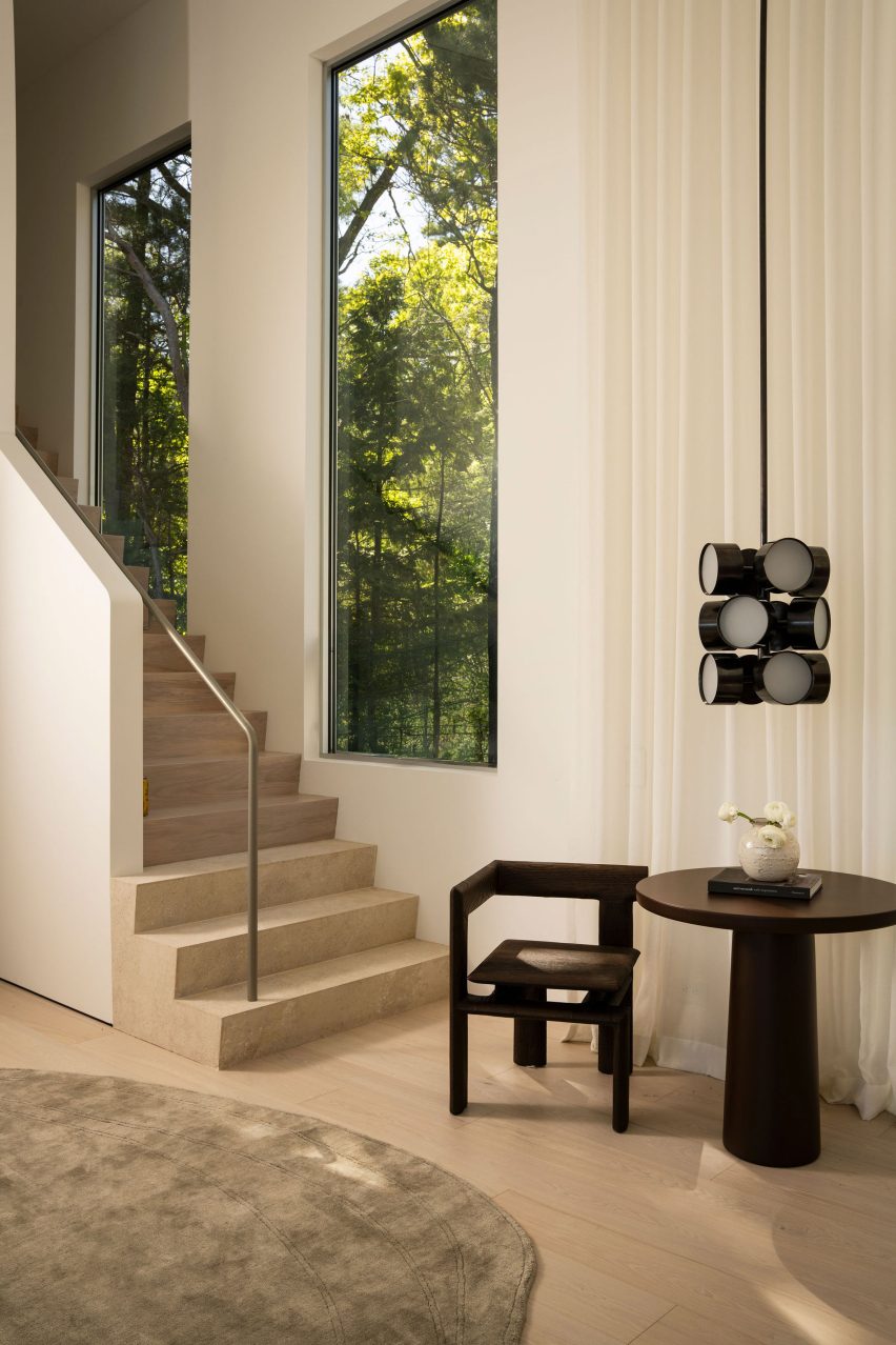 A main entry stair made from travertine and ash