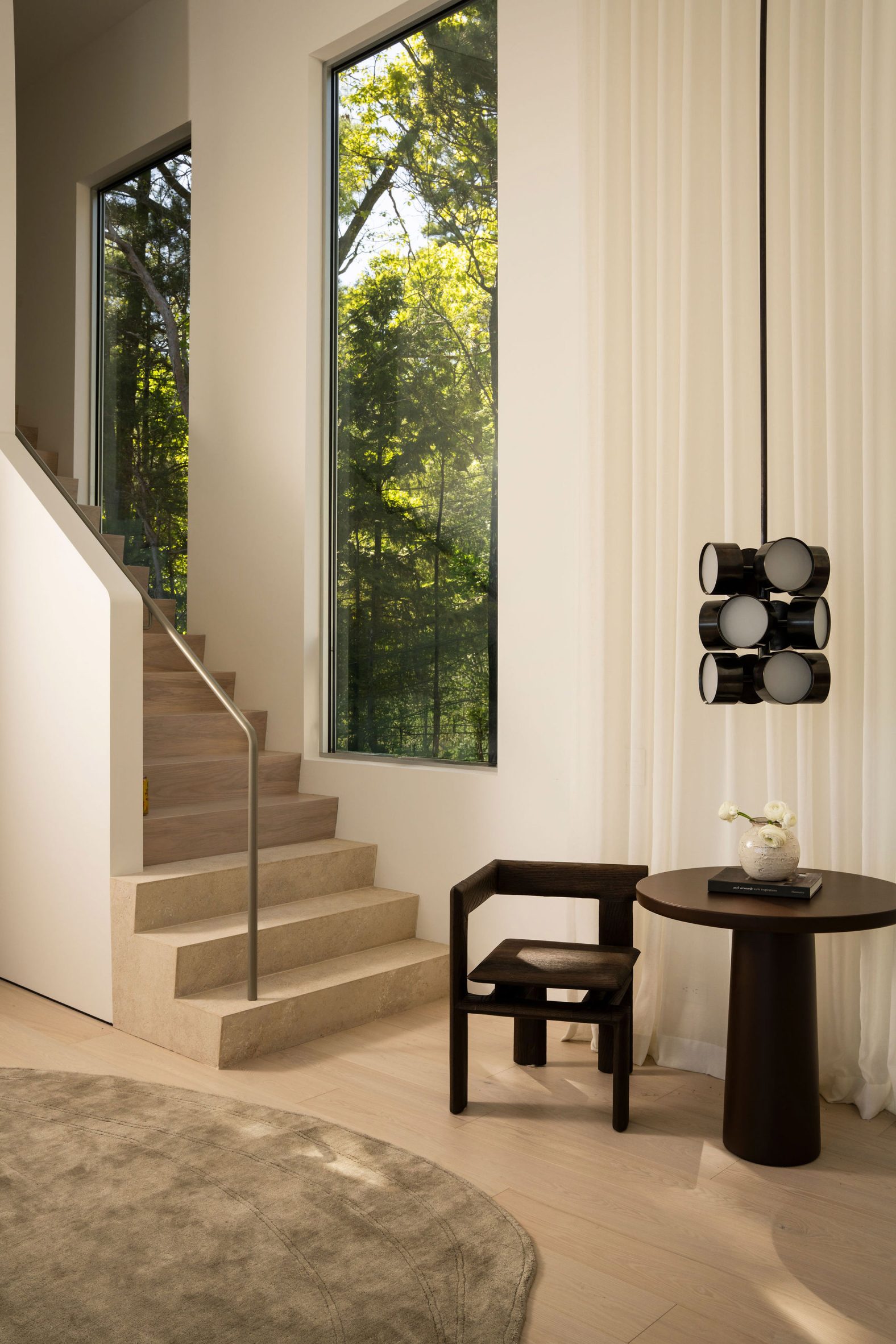 A main entry stair made from travertine and ash