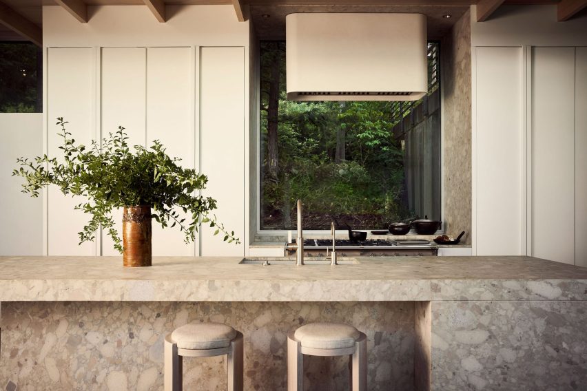 Kitchen with a new window that provides a forest view