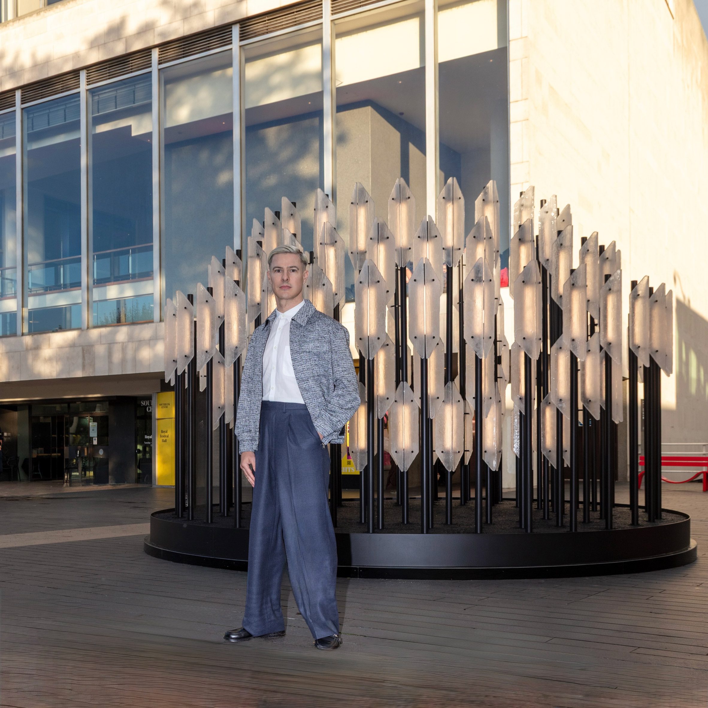 Photo of Lee Broom in front of installation