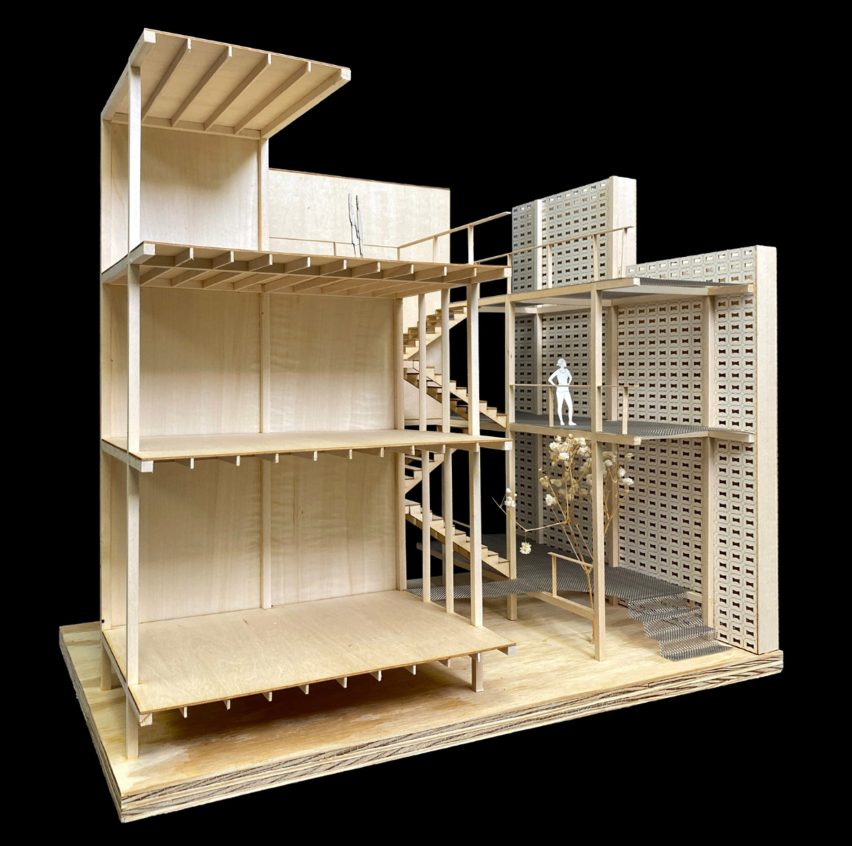 Architectural model made of wood. The model shows a cross-section of a building.