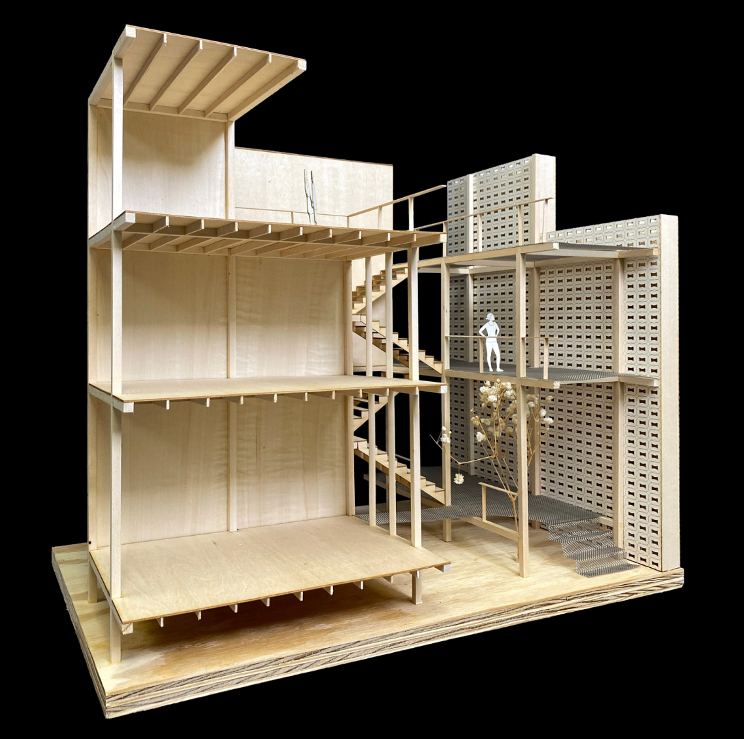 Architectural model made of wood. The model shows a cross-section of a building.