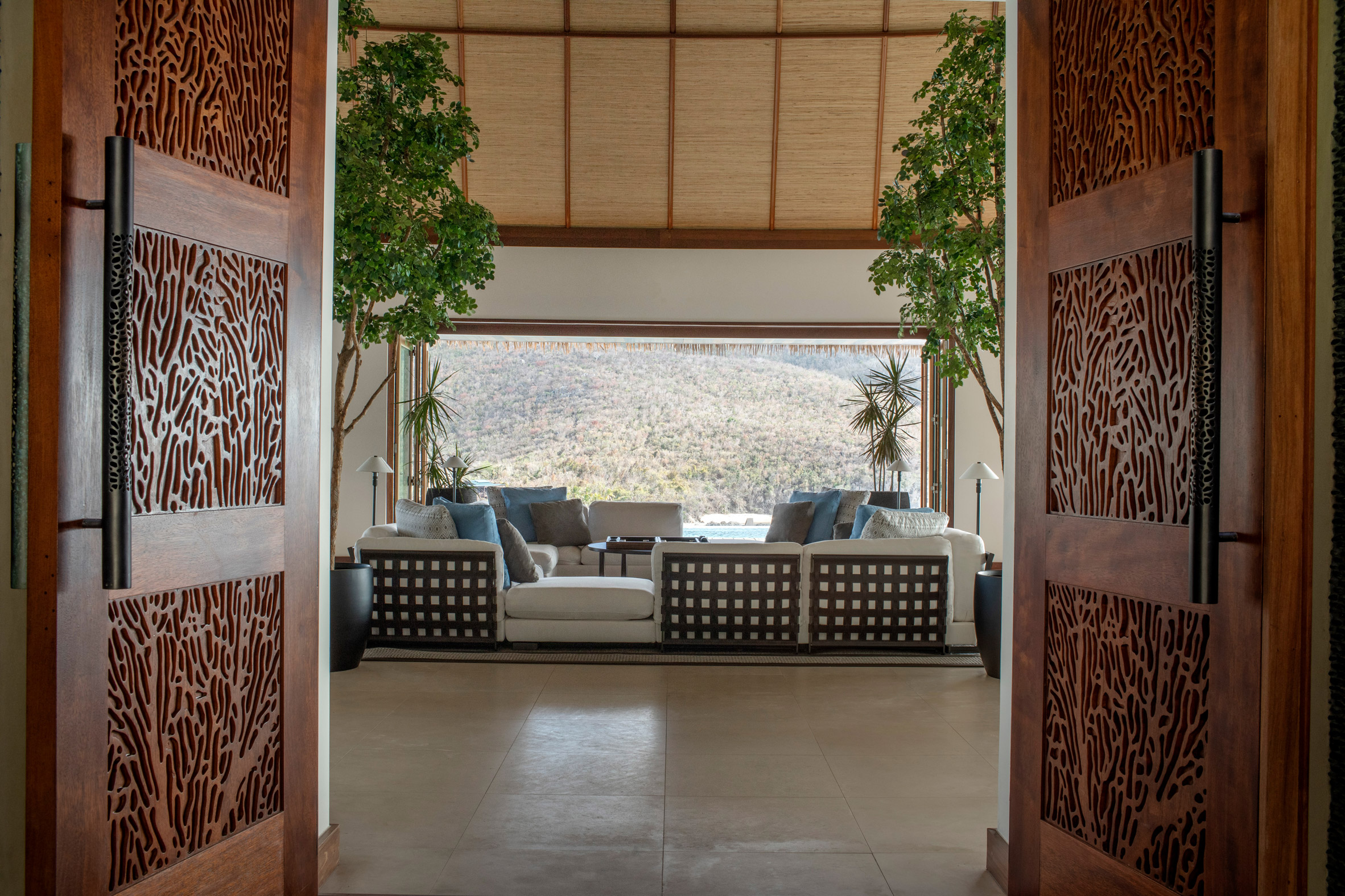 View through a door into a living area with large picture window
