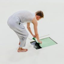 Dancers pull clothes from Tate Modern floor for Issey Miyake show