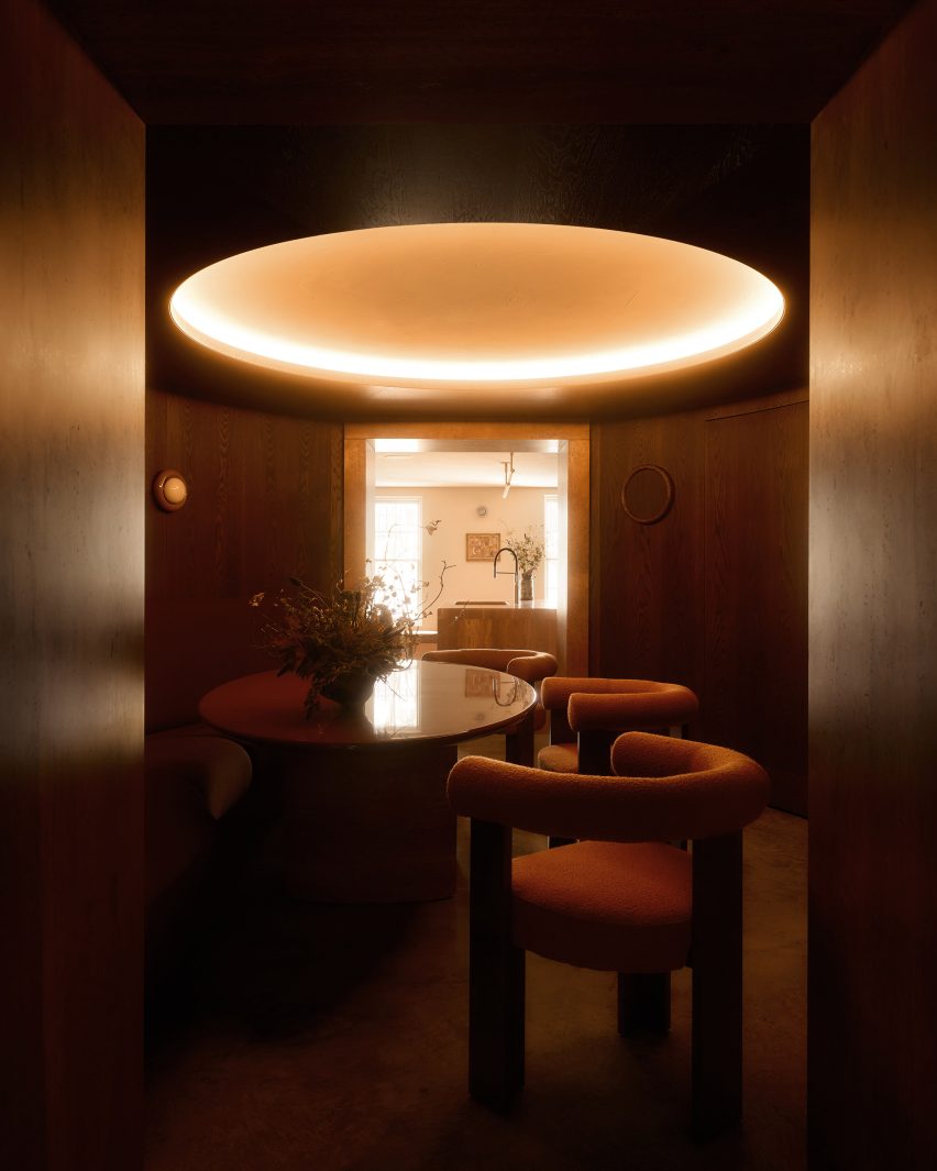 Dark timber dining room by Anam Design Studio