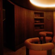 Dark timber dining room by Anam Design Studio