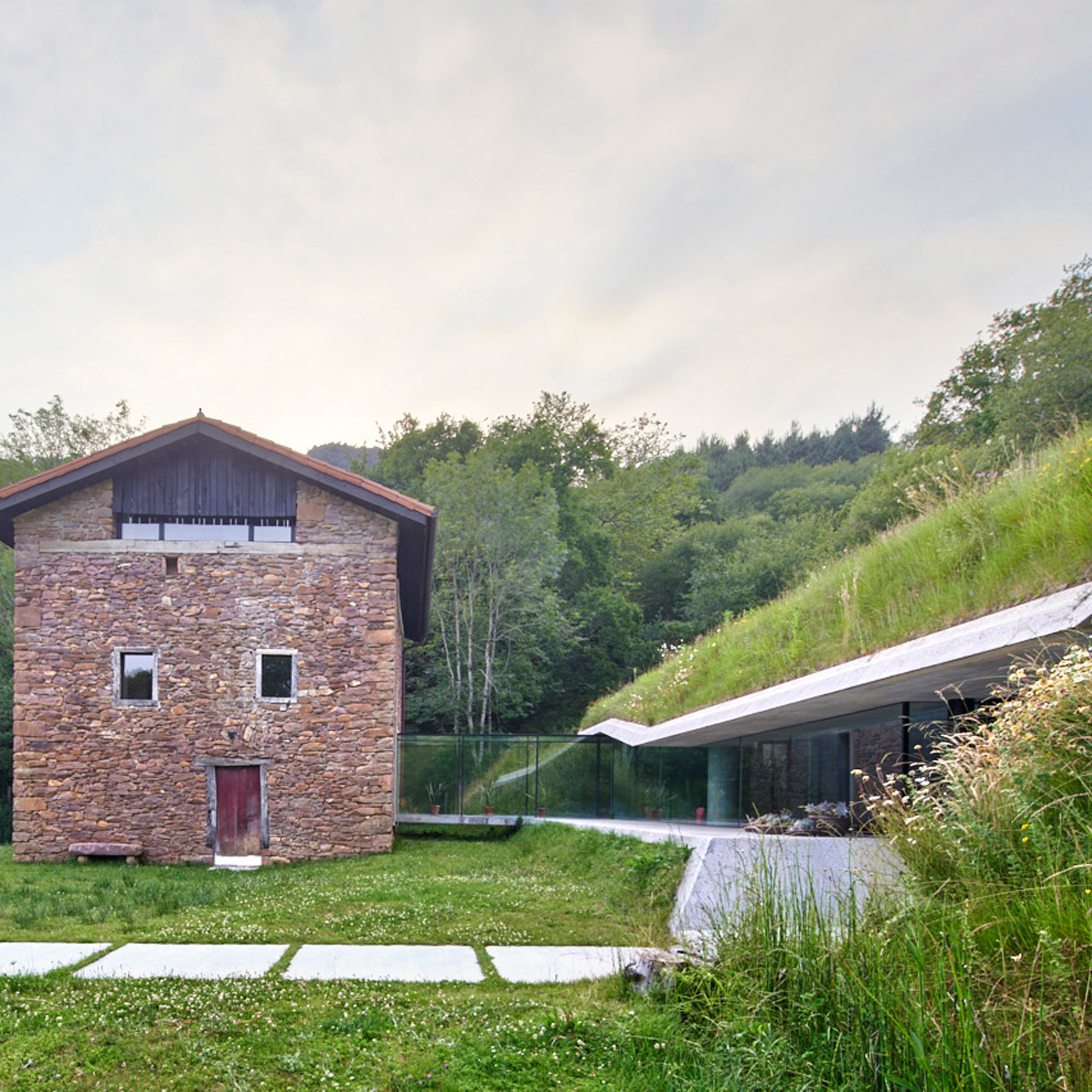 House with a green roofed extension