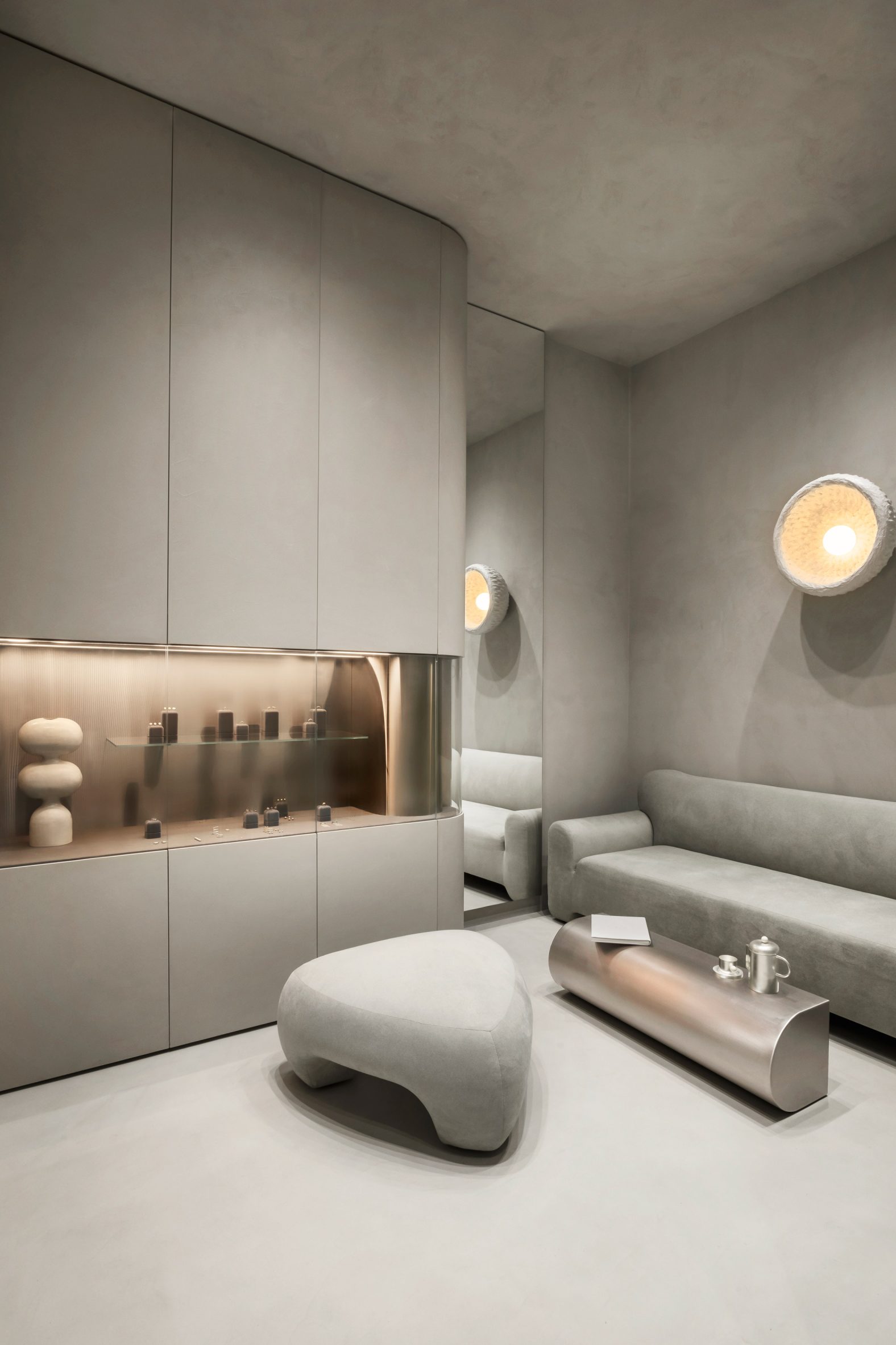 A consultation area in the back of a boutique is furnished with pieces from Faina