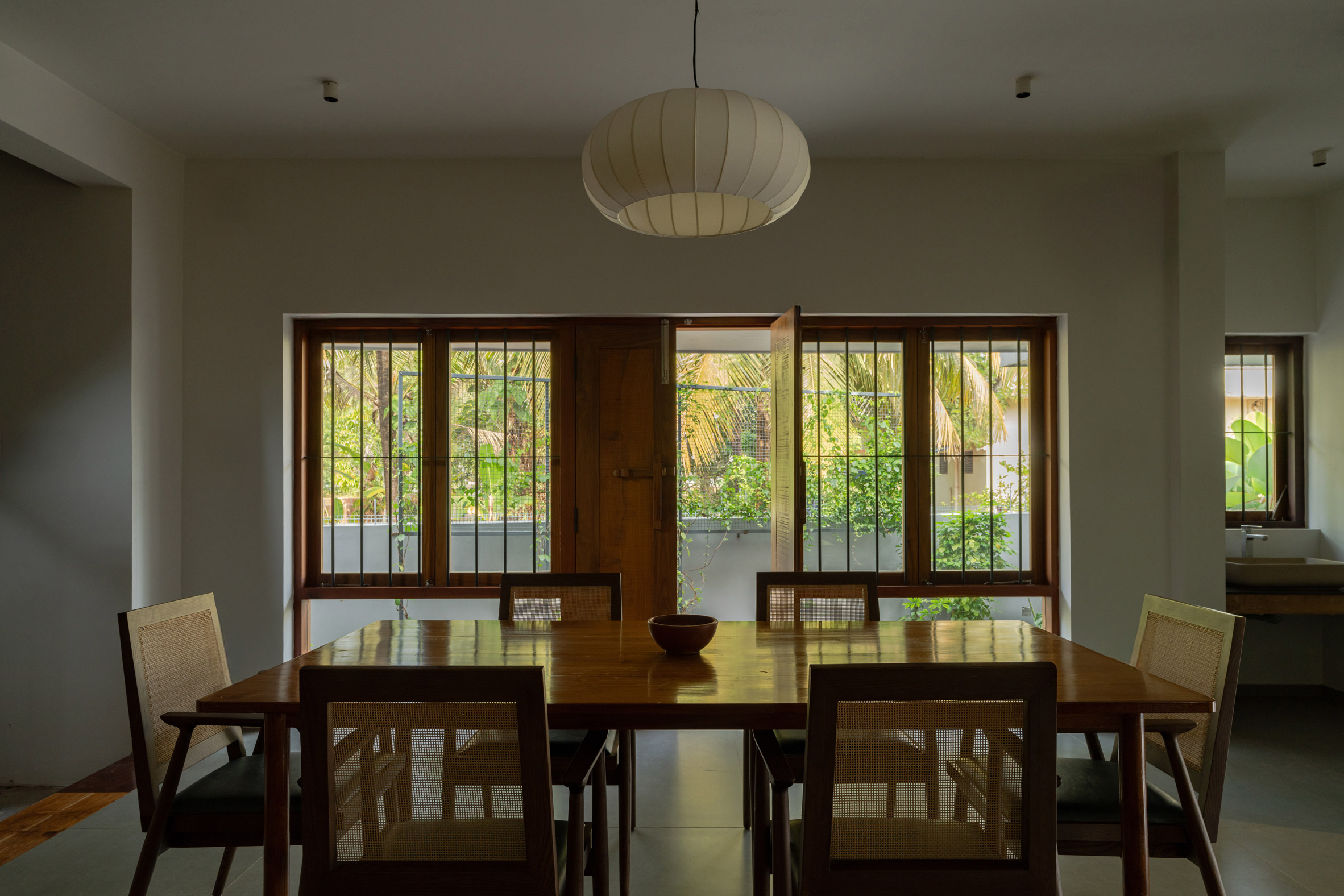 Dining room interior at House Beyond the Mango Trees by InLe Architects