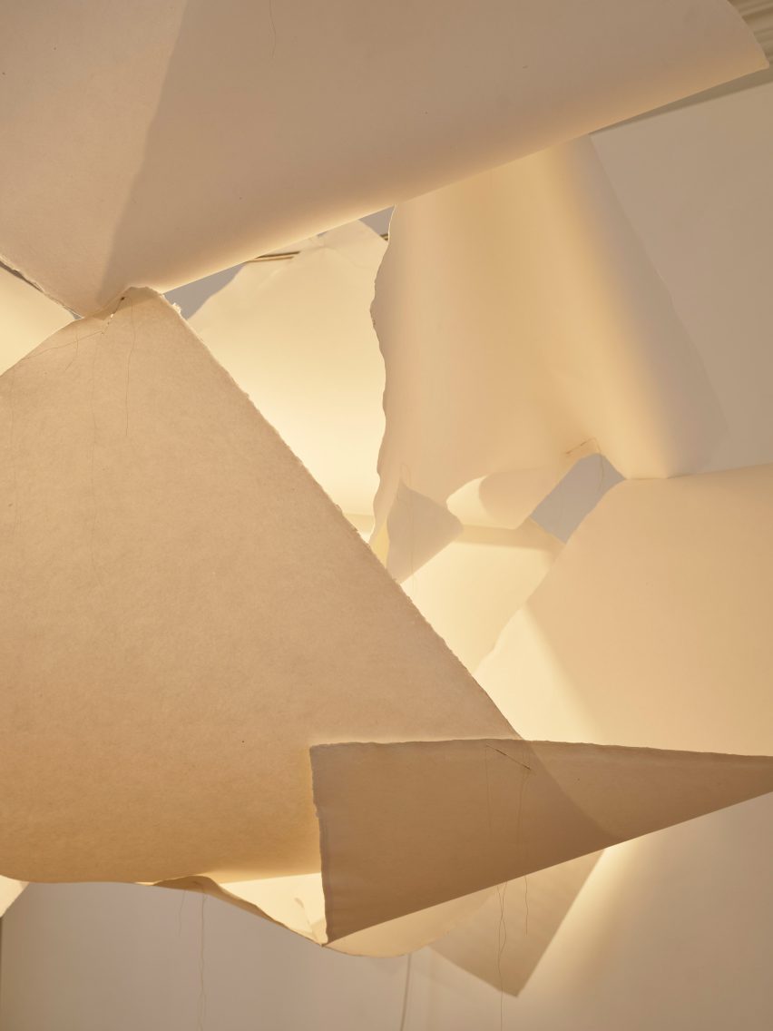 A lamp with a shade made from paper