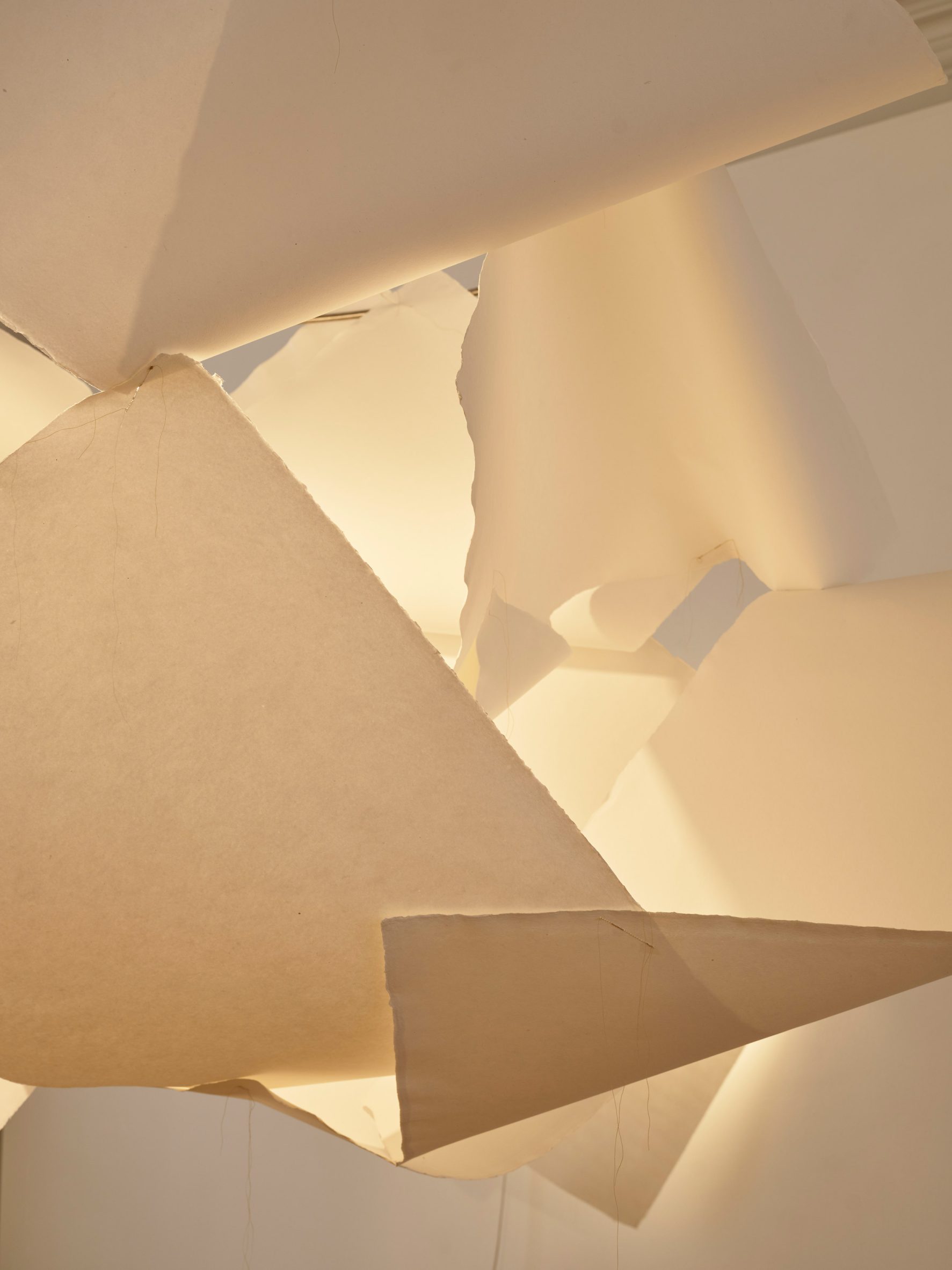 A lamp with a shade made from paper