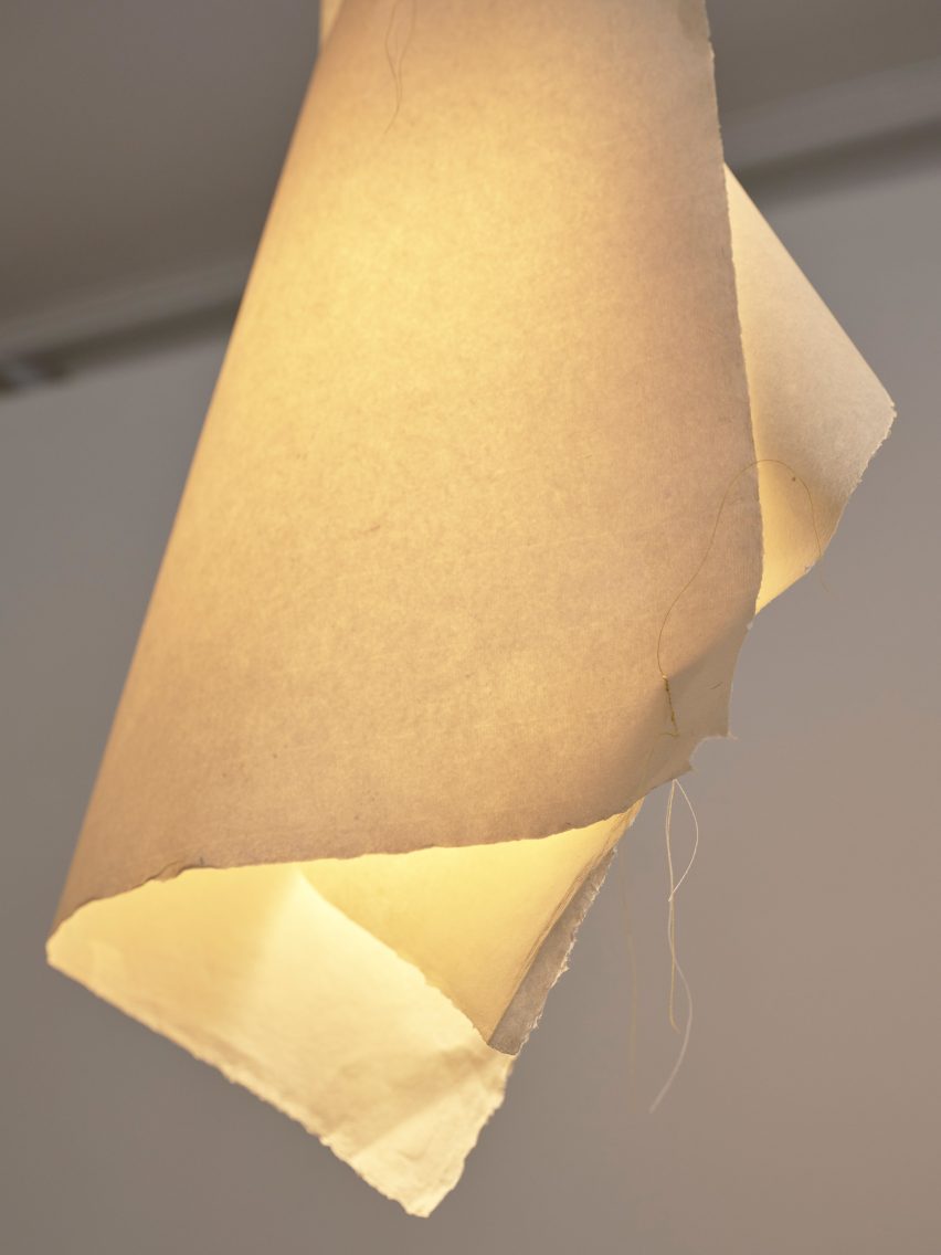 A lamp with a shade made from paper