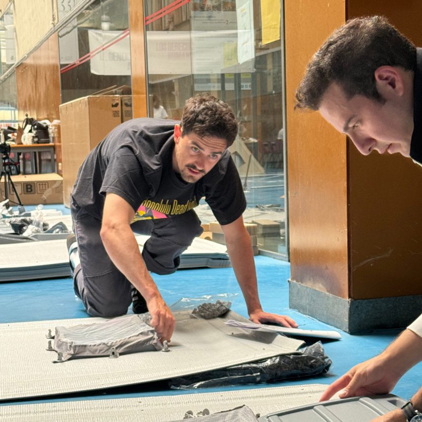 Students measuring something on the floor