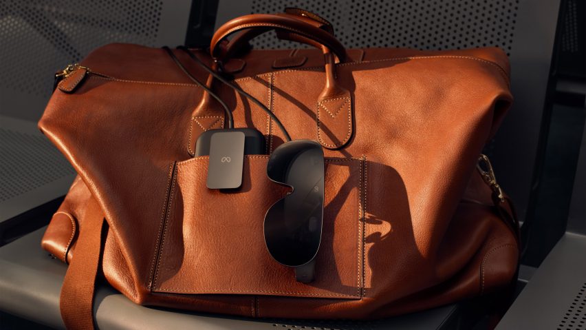 Image of the Meta VR Glasses tucked into the pocket of a leather handbag
