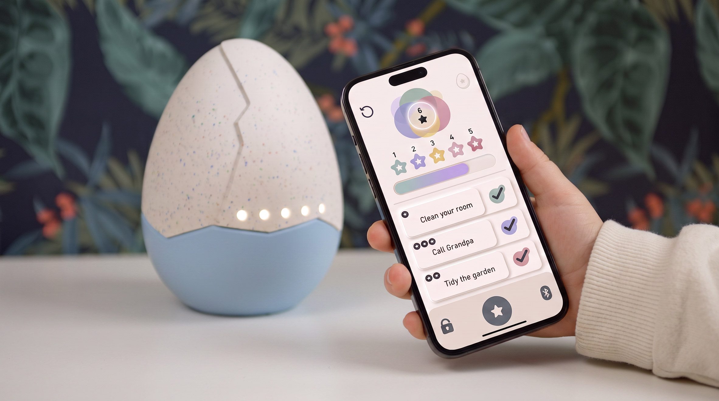 Hand holding an app in front of an egg
