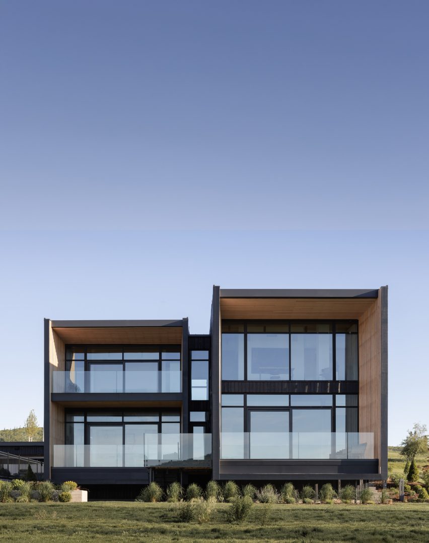 Black house with two window bays