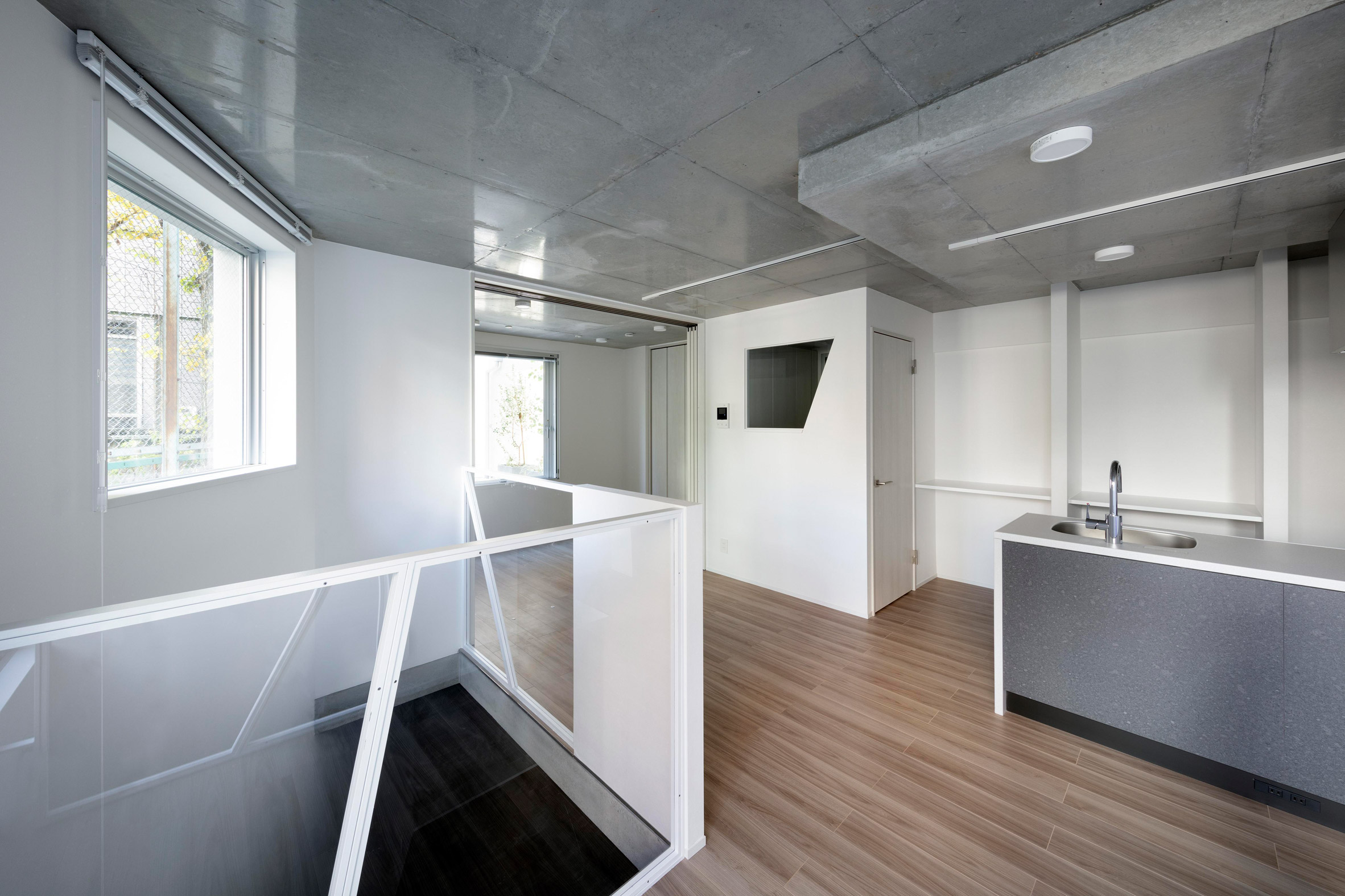 Interior view of condo at Shin Nakano Trapezoidal by Ryuichi Sasaki Architecture
