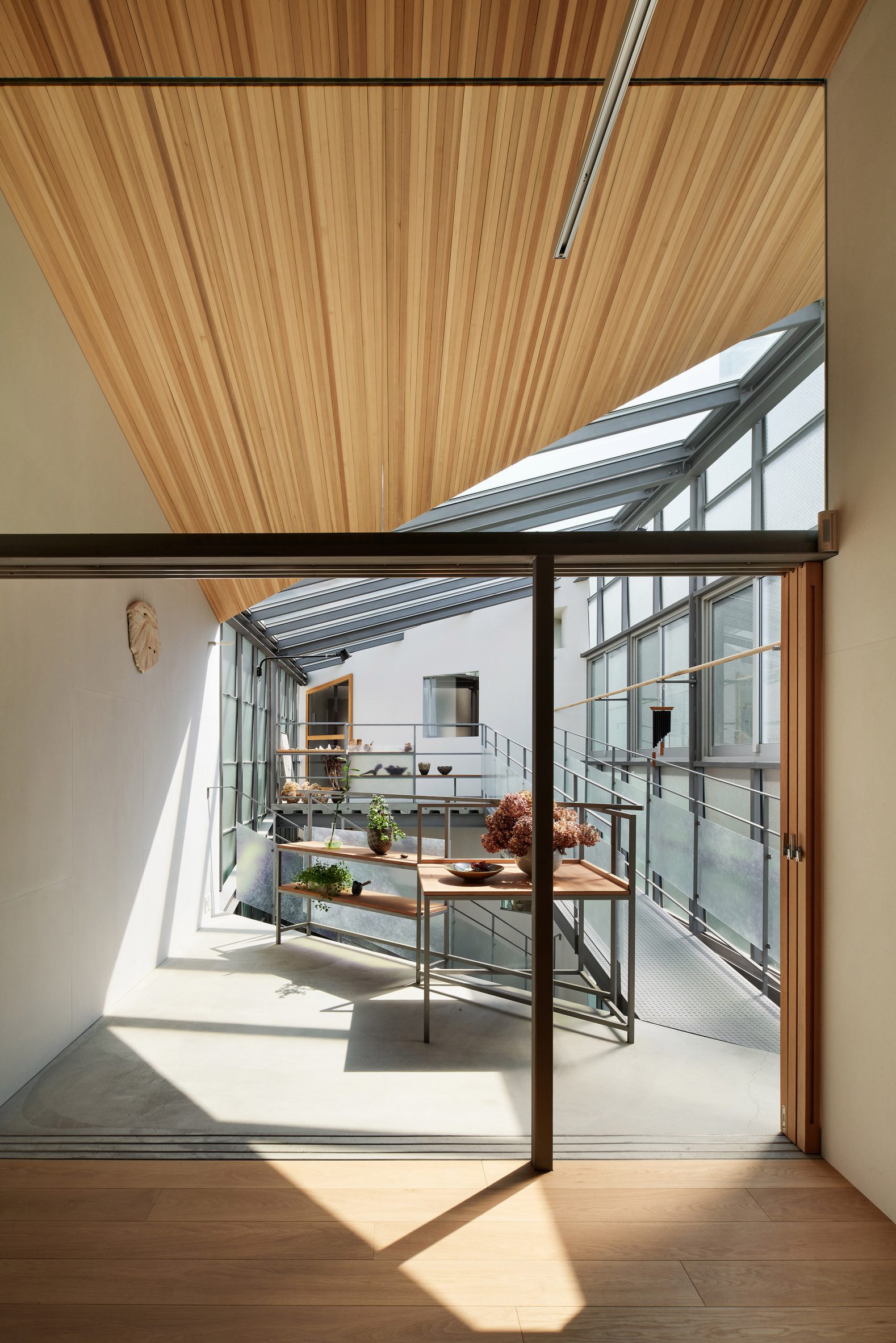 Upper floor within residence by Tato Architects