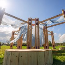Wildflower installation among timber prototypes at BuildFest 2026