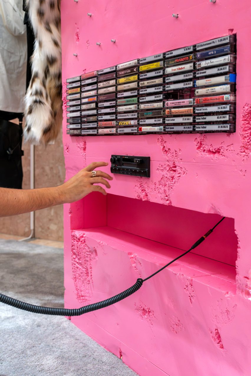 Cassettes and a player inside a pink frame